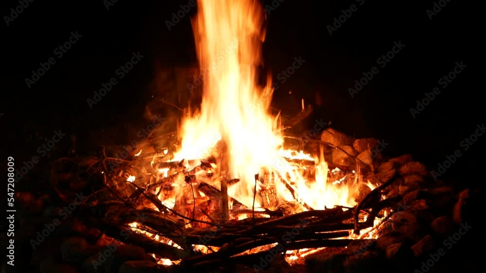 Bonfire at night with coals in the da Bonfire at night with coals in the da