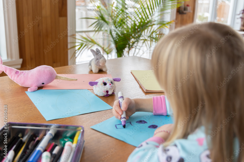 Little girl drawing stuffed toy Little girl drawing stuffed toy