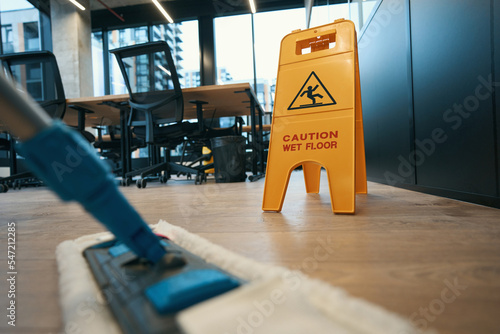 Foto Cleaning with special mop in the modern office