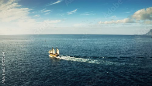 Old wooden historic ship with tourists sailing in the ocean
