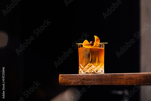 Fotografering old fashioned cocktail classic bourbon whiskey and bitters, orange peel and cher