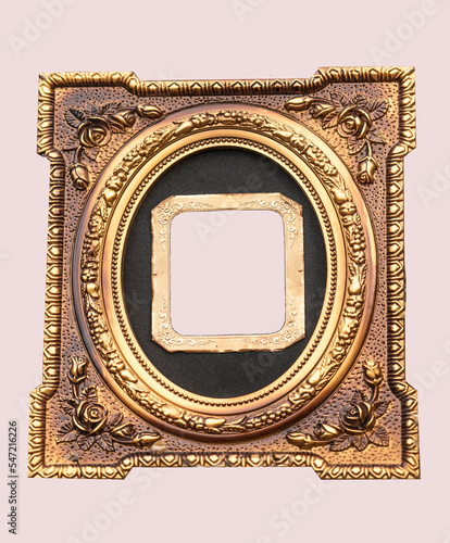 Isolated golden tintype picture frame. Old tintype frame  is in the center surrounded by modern oval frame with embossed  floral design.