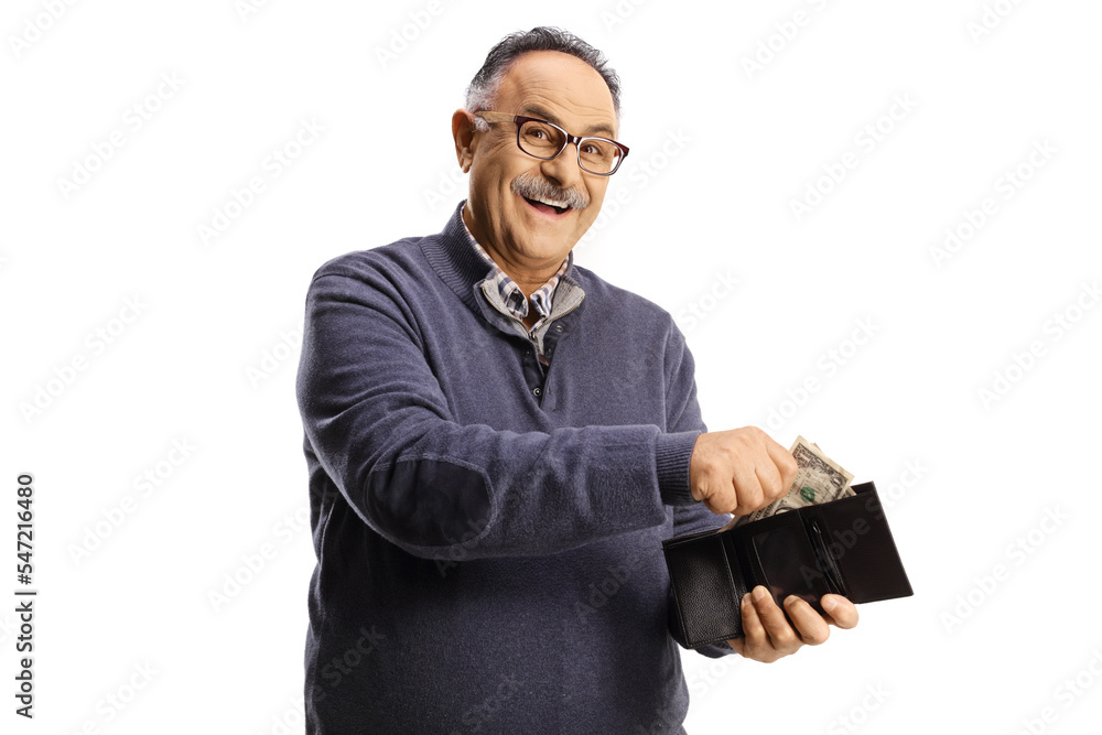 Cheerful mature man smiling and putting money in a wallet Cheerful mature man smiling and putting money in a wallet