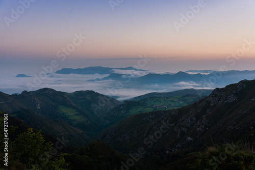 sunrise int he mountains with sea clouds