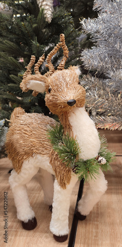 Big deer in front of the Christmas tree