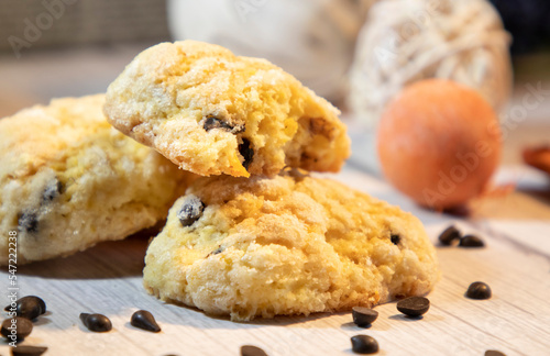 Orange chip cookies with chocolate drops on the wooden table 
