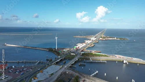 Afsluitdijk construction on pumping stations new sluices and the A7 near Den Oever, Kornwerderzand , and Zurich. Lock for shipping, road traffic cyclists and walkers. Aerial drone view. photo