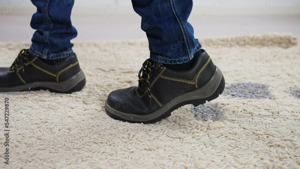 Person Walking With Muddy Footprint On Carpet Person Walking With Muddy Footprint On Carpet
