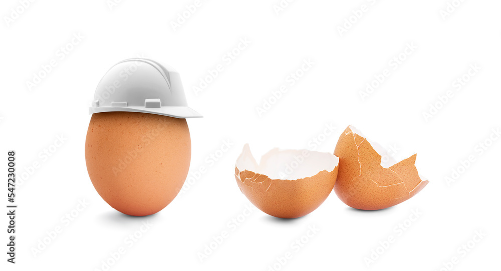 Egg with a construction helmet and broken egg Egg with a construction helmet and broken egg