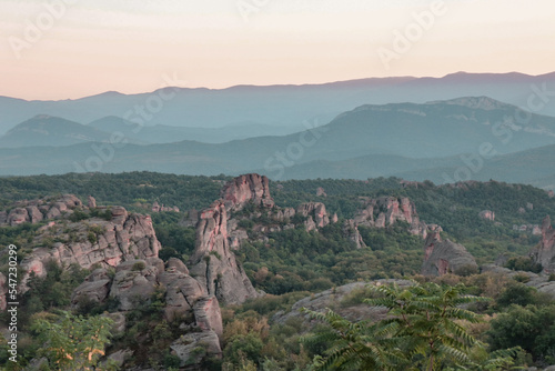 Stunning nature with high rocks and hills in Belogradchik in Bulgaria. Green nature and rocks in the wild with outstanding views.