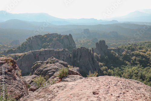 Stunning nature with high rocks and hills in Belogradchik in Bulgaria. Green nature and rocks in the wild with outstanding views.
