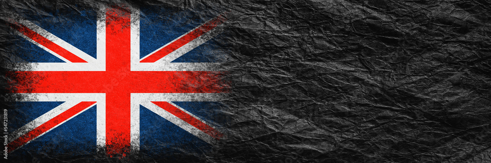 Fototapeta premium Flag of Britain. Flag is painted on black crumpled paper. Paper background. Copy space. Textured background