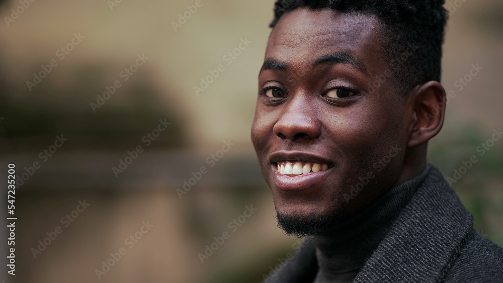 Friendly happy black African man portrait close-up smiling Friendly happy black African man portrait close-up smiling