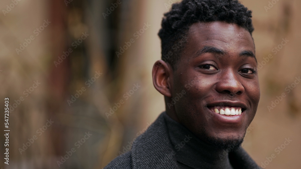 Friendly happy black African man portrait close-up smiling