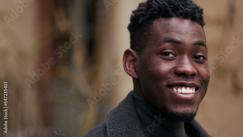 Friendly happy black African man portrait close-up smiling