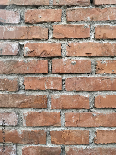 The wall made of an old brown bricks 