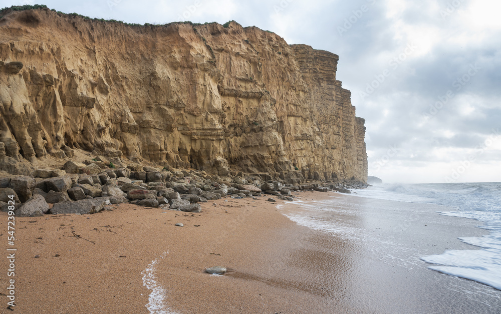 Rock formations, sandstone cliffs in West Bay beach, located near Bridport in Dorset, United Kingdom. Part of famous Jurassic coast, World Heritage Site, selective focus
