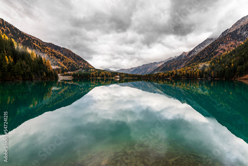 Reflections on the Anterselva lake, Alto Adige, Italy. photo