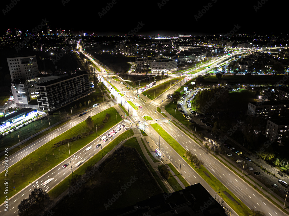 Night traffic transportation at the roundabout street road, City and connection technology, futuristic abstract background for financial technology and business innovation Night traffic transportation at the roundabout street road, City and connection technology, futuristic abstract background for financial technology and business innovation