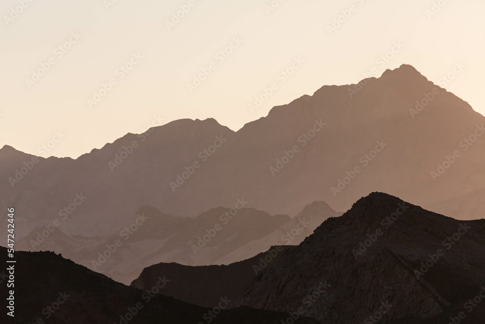 Dramatic layered mountains of Sinai in the evening. View from Dahab. Dahab, Sinai peninsula, Egypt