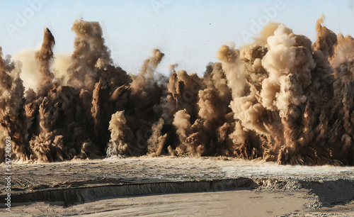 Dust clouds due to detonator blast on the mining site in the Oman photo