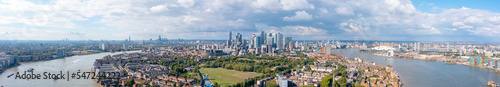 London panorama, the city on the river bank, with residential buildings, green areas, and modern skyscrapers, aerial view. © 24K-Production