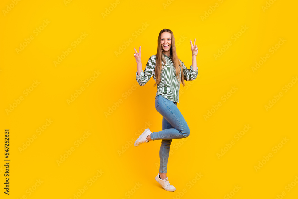 Full body photo of excited lady have fun say hello make v sign isolated over vivid shine color background Full body photo of excited lady have fun say hello make v sign isolated over vivid shine color background