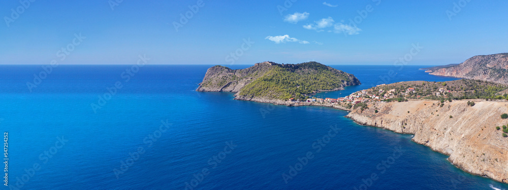 Aerial drone wide panoramic photo of beautiful colourful and picturesque small fishing coastal village of Assos in island of Kefalonia, Ionian, Greece