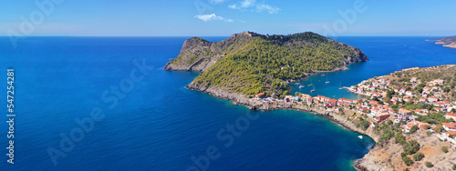 Aerial drone wide panoramic photo of beautiful colourful and picturesque small fishing coastal village of Assos in island of Kefalonia, Ionian, Greece