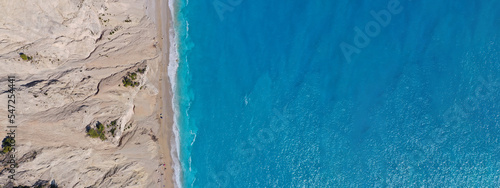 Aerial drone photo of famous paradise beach of Egremni white steep rocky hills overlooking deep turquoise Ionian sea, Lefkada island photo