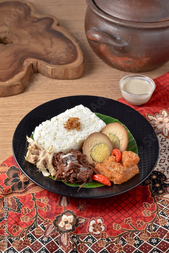 Gudeg is a traditional dish from Yogyakarta, Indonesia. Made from young unripe jack fruit. Served with rice, krecek, telur bacem, and shreded chicken. 