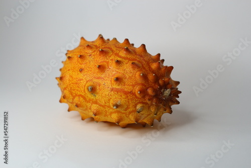 kiwano fruit, Also called African Horned Cucumber or Jelly Melon, the grapefruit size oval melon with horn like spines has a yellow orange skin with lime green jelly-like flesh. 