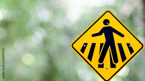 Pedestrian crossing sign and blurred background with bokeh.