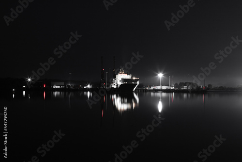 Black & white industrial boat at night © Emanuil