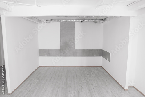 Empty office room with white walls and ventilation system. Interior design