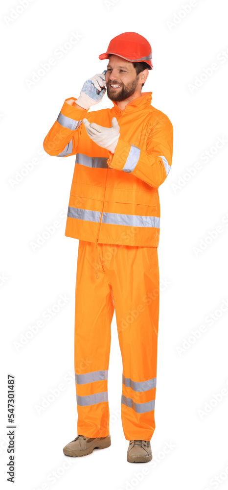Man in reflective uniform talking on smartphone against white background Man in reflective uniform talking on smartphone against white background