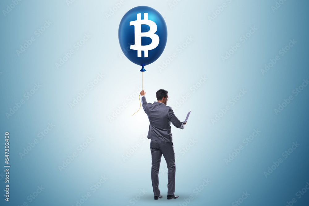 Businessman in bitcoin bubble concept