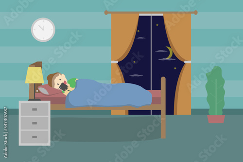 Boy using mobile phone on the bed till late night
