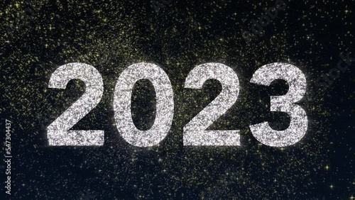 2023 tittle animation on a black background with fireworks. Happy New Year 2023 Greetings Card Abstract Blinking Sparkle Glitter Particle. Merry Christmas. 