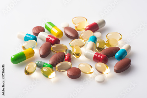 medical pills and tablets and vitamin capsules supplementary food on white background close up.