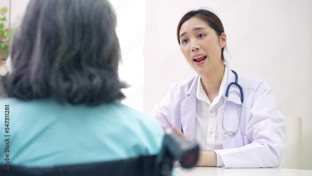 Physician examining heart with a stethoscope and talking with a senior woman at a clinic for check yearly checkup, Medicine health care service and medical insurance concept. Physician examining heart with a stethoscope and talking with a senior woman at a clinic for check yearly checkup, Medicine health care service and medical insurance concept.