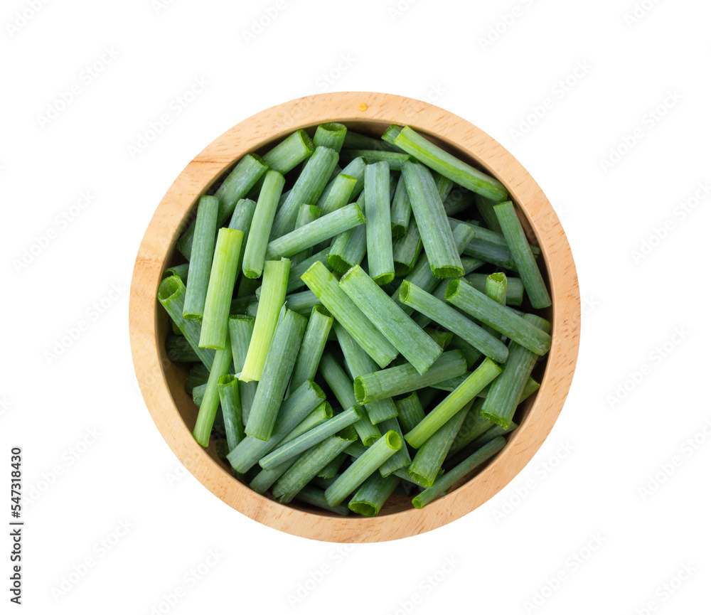 Slice green onions in wood bowl on transparent png Slice green onions in wood bowl on transparent png