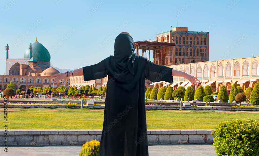 Beautiful Iranian girl wearing abaya with arms up happy Shah (Imam