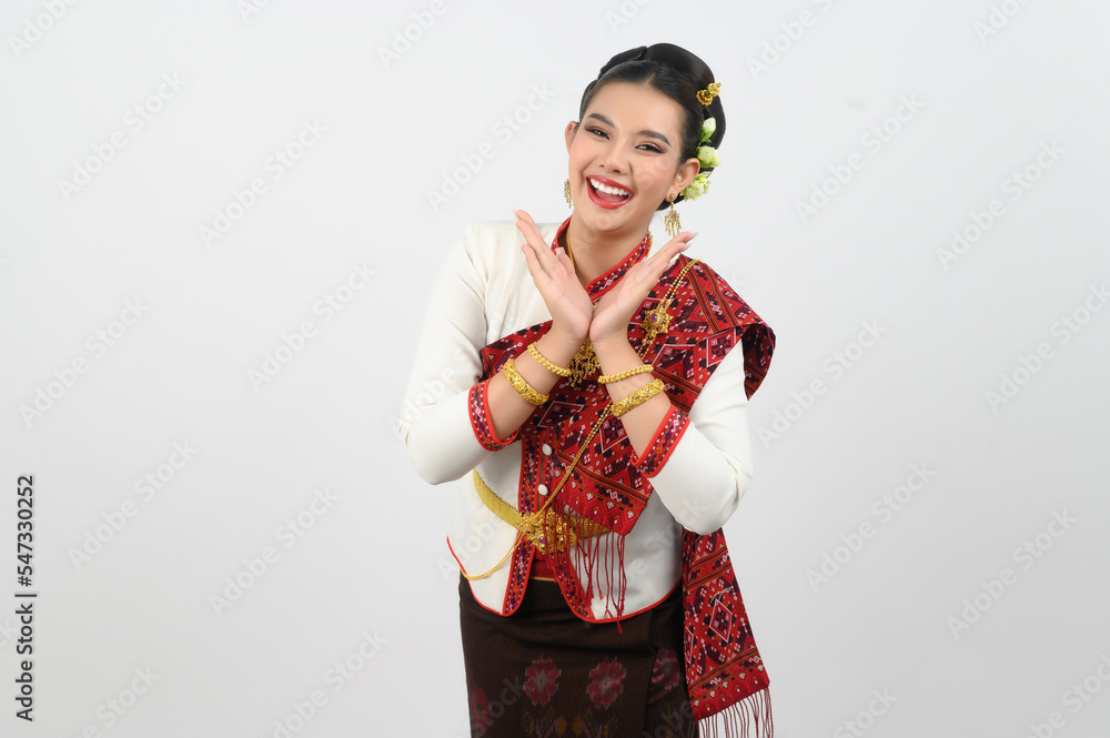 Asian pretty woman in northeastern dress stand in beautiful Thai dance Asian pretty woman in northeastern dress stand in beautiful Thai dance