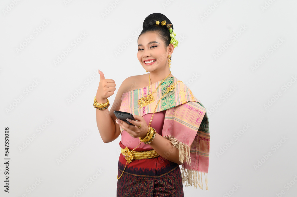 Young beautiful woman in northeastern dress use smartphone posture Young beautiful woman in northeastern dress use smartphone posture