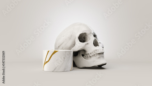 An abstract small marble platform repaired with gold in the Kintsugi method, backed by a marble skull