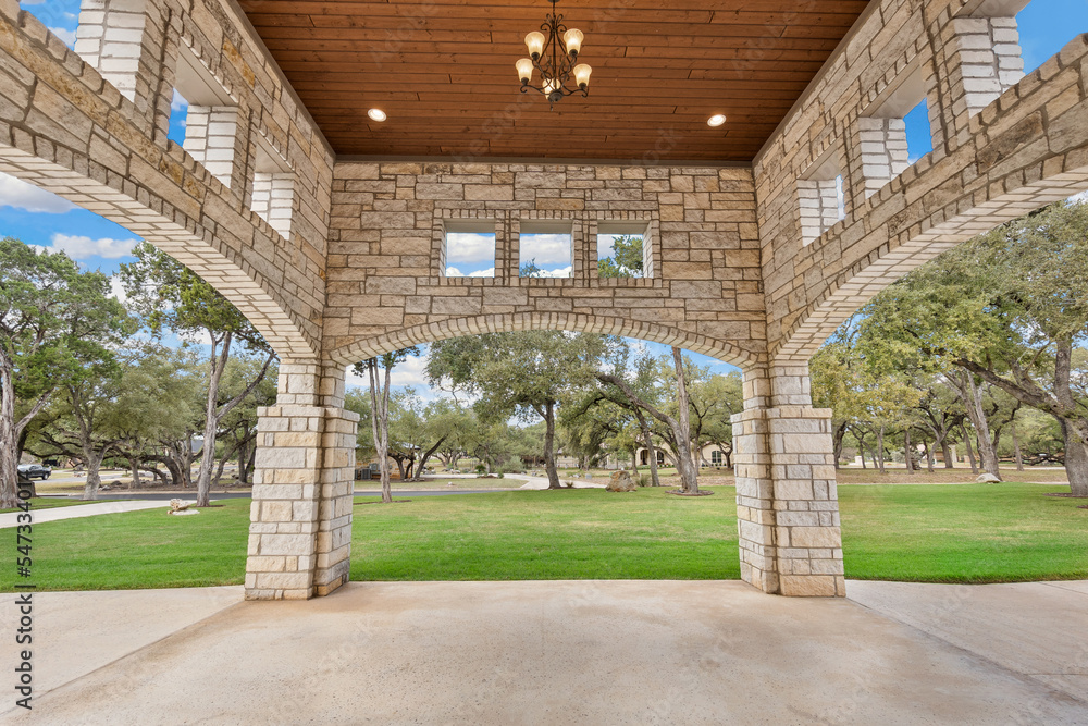 Large home with an arched driveway