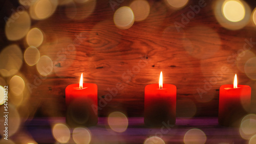 wooden background for labels with Christmas lights and candles