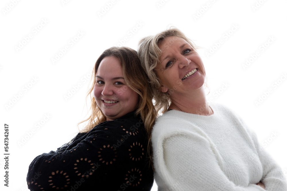 Young 25 woman with her blonde 50 mother on white background Young 25 woman with her blonde 50 mother on white background