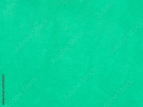 Bright green canvas textile texture background of natural cloth fabric natural cotton or linen material seamless